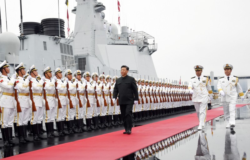 Chinese President Xi Jinping reviews the honor guards of the Chinese People’s Liberation Navy before boarding the destroyer Xining for the naval parade celebrating the 70th founding anniversary of the Chinese People's Liberation Army Navy in Qin