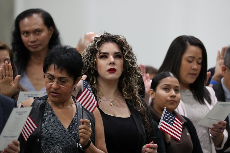 Immigrants attend a naturalization ceremony to become new U.S. citizens in Los Angeles