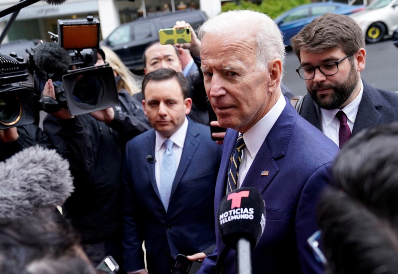 FILE PHOTO: Former Vice President Biden speaks to reporters after speaking at electrical workers’ conference in Washington