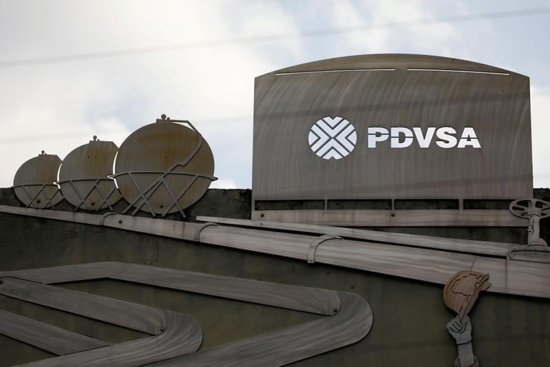 FILE PHOTO: FILE PHOTO: Cutouts depicting images of oil operations are seen outside a building of Venezuela's state oil company PDVSA in Caracas