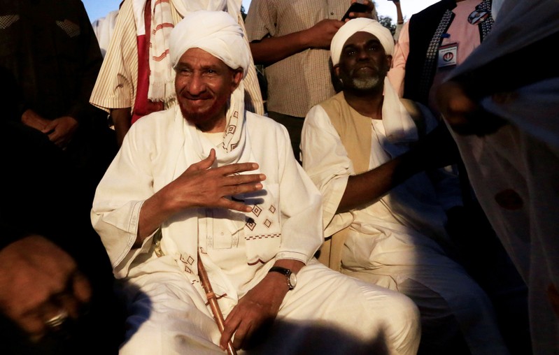 FILE PHOTO: Sudanese opposition figure Sadiq al-Mahdi meets his supporters after he returned from nearly a year in self-imposed exile in Khartoum