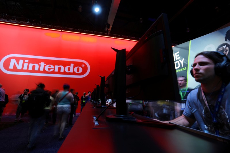 FILE PHOTO: Attendee plays a video game at the E3 2017 Electronic Entertainment Expo in Los Angeles