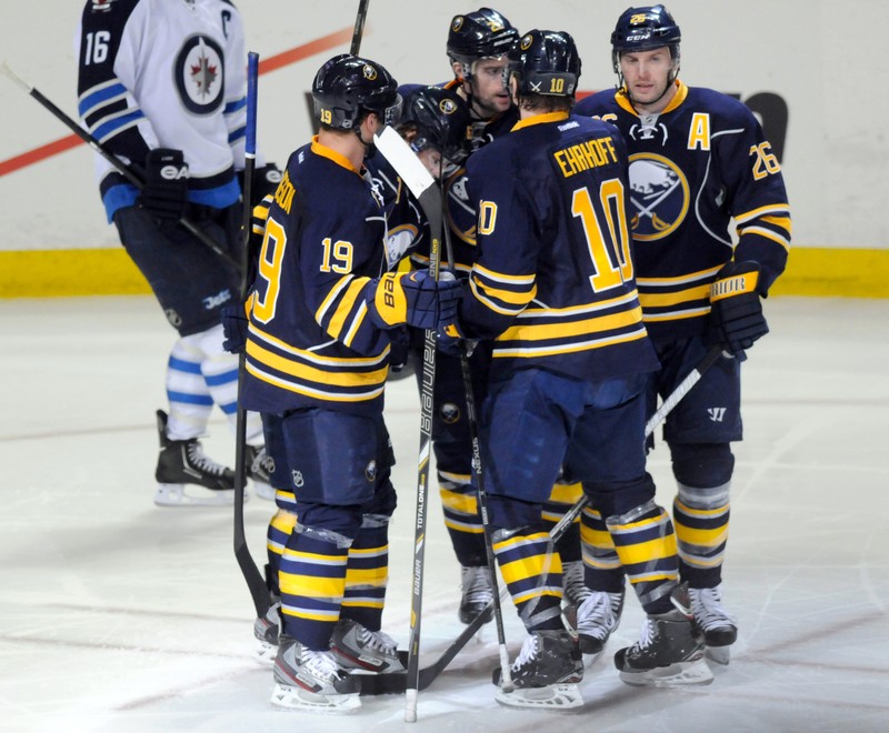 Buffalo Sabres Hodgson, Ehrhoff and Vanek celebrate Vanek's goal with teammates, against the Winnipeg Jets during the second period of their NHL hockey game in Buffalo