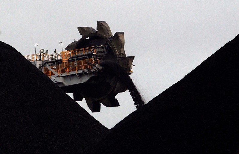 A reclaimer places coal in stockpiles at the coal port in Newcastle