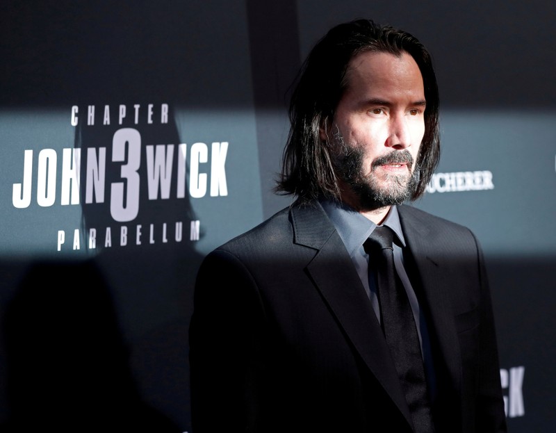 FILE PHOTO: Cast member Keanu Reeves arrives for a screening of the movie