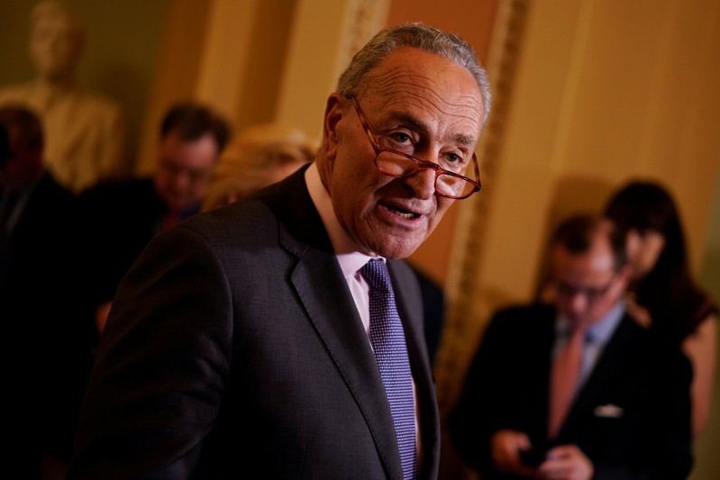 FILE PHOTO: Senate Minority Leader Chuck Schumer speaks with reporters following the weekly policy luncheons on Capitol Hill
