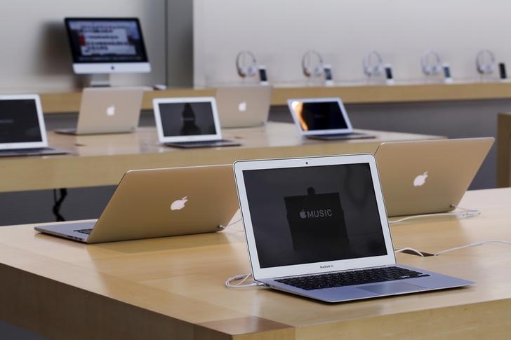 FILE PHOTO: Rows of Apple laptop computers are seen at the Apple Store in Palo Alto