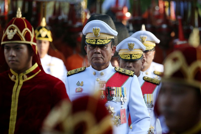 FILE PHOTO: Thailand's Prime Minister Prayuth Chan-ocha attends the coronation procession for Thailand's newly crowned King Maha Vajiralongkorn