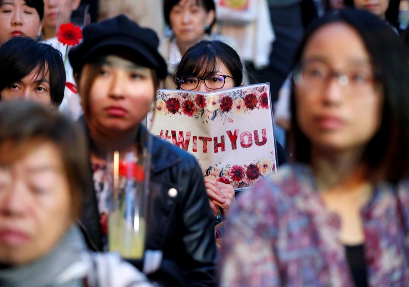 Protesters gather at the rally called 'Flower Demo' to criticize recent acquittals in court cases of alleged rape in Japan and call for revision of the anti-sex crime law, in Tokyo