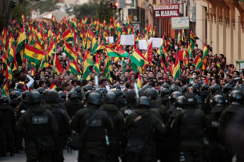 Bolivians banged on pots and pans from windows and rooftops in the capital La Paz on Friday, protesting a controversial election count handing President Evo Morales a fourth consecutive term that would extend his rule to nearly two decades.