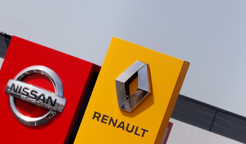 The logos of car manufacturers Renault and Nissan are seen in front of dealerships of the companies in Reims