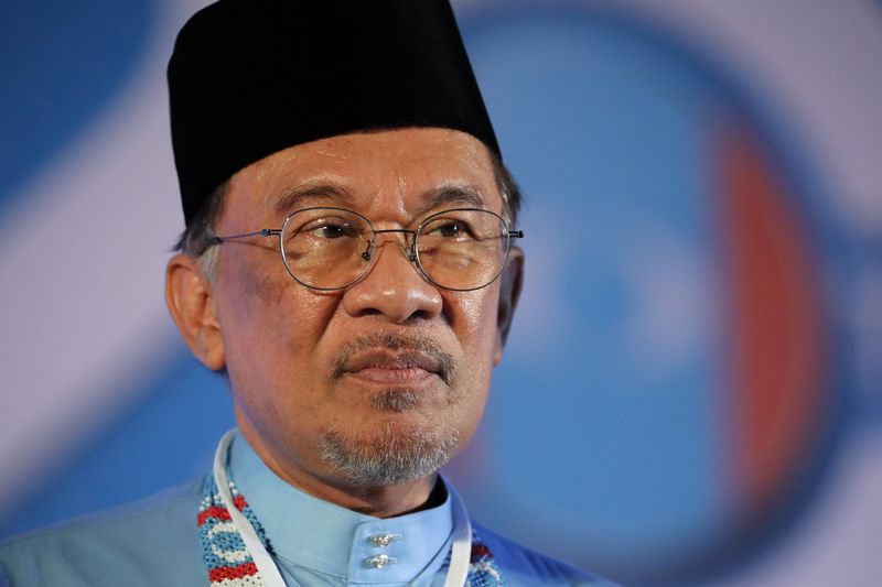 President of the People’s Justice Party Anwar Ibrahim reacts during their general assembly in Melaka
