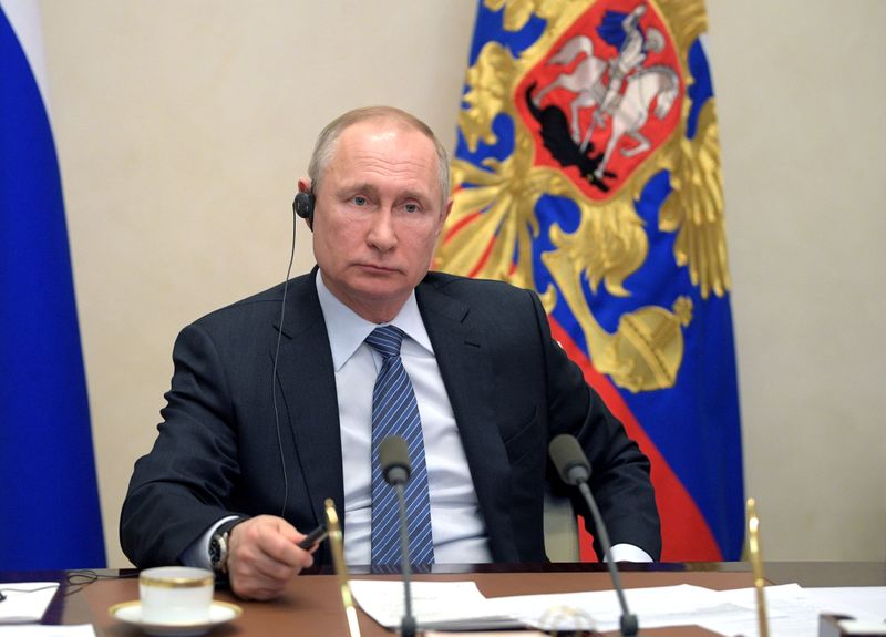 Russian President Putin takes part in a meeting with G20 leaders via video link at his residence outside Moscow