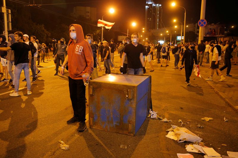 Clashes with opposition supporters after polls closed at the presidential election in Minsk