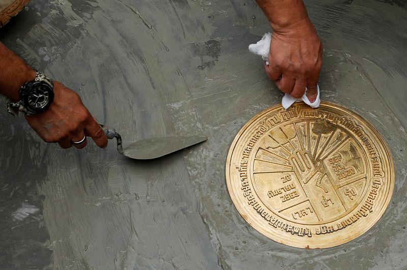 Student leaders install a plaque declaring