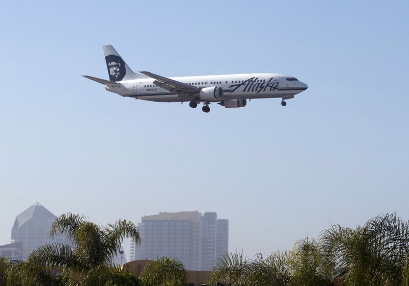 FILE PHOTO: An Alaska Airlines Boeing 737 plane is shown on final approach to land in San Diego