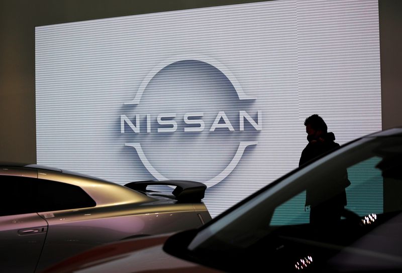 FILE PHOTO: A visitor is seen at a Nissan Motor showroom in Tokyo