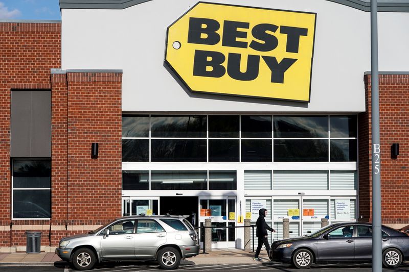 FILE PHOTO: People wait for purchases outside of a Best Buy store due to the outbreak of coronavirus in Arlington, Virginia